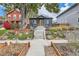 Charming home with a landscaped front yard and inviting entryway steps at 1538 Albion St, Denver, CO 80220