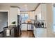 Well-equipped kitchen with stainless steel appliances, white cabinetry, and granite countertops at 1538 Albion St, Denver, CO 80220