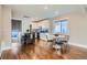 Open kitchen with white cabinetry flowing into the dining area on beautiful hardwood floors at 1538 Albion St, Denver, CO 80220