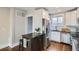 Modern kitchen featuring stainless steel appliances, granite countertops, and hardwood floors at 1538 Albion St, Denver, CO 80220