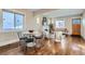 Cozy living room features a fireplace, large windows, hardwood floors and neutral colors at 1538 Albion St, Denver, CO 80220