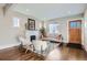 Open-concept living room featuring a fireplace, modern furniture, and hardwood floors at 1538 Albion St, Denver, CO 80220
