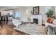 Cozy living room with a fireplace, stylish furniture, and hardwood floors at 1538 Albion St, Denver, CO 80220