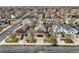 A high-angle shot highlights a neighborhood with a mix of homes, showcasing front yards and streetscapes, and available parking at 6190 Sparrow Ave, Firestone, CO 80504