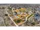 A beautiful aerial view shows a well-equipped park with walking paths nestled within a charming residential neighborhood at 6190 Sparrow Ave, Firestone, CO 80504