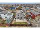 Aerial shot of a private backyard with a patio, small lawn, wooden fence, and barbecue area, perfect for outdoor entertaining at 6190 Sparrow Ave, Firestone, CO 80504