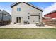 A beautiful backyard, with a patio, grill, and well-maintained lawn, perfect for entertaining at 6190 Sparrow Ave, Firestone, CO 80504