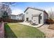 Enjoy the spacious backyard with a patio, grassy area, and garden bed, perfect for outdoor living at 6190 Sparrow Ave, Firestone, CO 80504