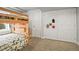 Cozy bedroom featuring a wooden bunk bed and neutral carpet, perfect for  at 6190 Sparrow Ave, Firestone, CO 80504