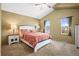 Inviting bedroom featuring vaulted ceilings, carpeted floors, and abundant natural light from windows at 6190 Sparrow Ave, Firestone, CO 80504