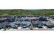 Scenic aerial view of a neighborhood nestled near green, rolling hills at 74 Lullaby Ln, Castle Rock, CO 80109