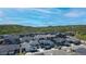 Aerial view of a neighborhood surrounded by lush, green hills at 74 Lullaby Ln, Castle Rock, CO 80109