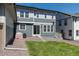 Backyard featuring a small lawn, crushed rock, and a sliding glass door entering the home at 74 Lullaby Ln, Castle Rock, CO 80109