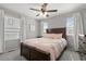 Bright bedroom featuring a bed with wood frame, and multiple windows allowing for ample natural light at 74 Lullaby Ln, Castle Rock, CO 80109