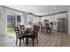 Open kitchen and dining area with natural light, stainless steel appliances, and access to the backyard at 74 Lullaby Ln, Castle Rock, CO 80109