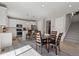 Bright kitchen with stainless steel appliances, white cabinets, and an adjacent dining area at 74 Lullaby Ln, Castle Rock, CO 80109