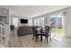 Spacious living room filled with natural light, comfortable seating, and a sliding glass door to the backyard at 74 Lullaby Ln, Castle Rock, CO 80109