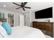 Comfortable main bedroom with wood furnishings and large mounted television at 74 Lullaby Ln, Castle Rock, CO 80109