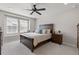 Serene primary bedroom with a large window, comfortable bed, and stylish nightstands at 74 Lullaby Ln, Castle Rock, CO 80109