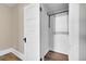 A well-organized closet features a metal rack and wooden floors, providing ample storage space in the home at 3132 Umatilla St # B, Denver, CO 80211