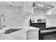 Stainless steel range and sink in a corner kitchen at 3132 Umatilla St # B, Denver, CO 80211