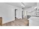 Modern kitchen featuring white cabinets, stainless steel appliances, and hardwood flooring at 3132 Umatilla St # B, Denver, CO 80211