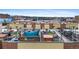 Enjoy spectacular city views from this townhome rooftop deck with hot tub, tables, and seating at 2325 Walnut St # 4, Denver, CO 80205