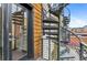 View of the balcony with a spiral staircase and a wood-paneled exterior at 2325 Walnut St # 4, Denver, CO 80205