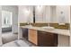 Bathroom with double sinks, modern faucets, a light countertop, and a backdrop of tasteful tile work at 2325 Walnut St # 4, Denver, CO 80205