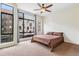 A bedroom featuring a large window with views and ceiling fan at 2325 Walnut St # 4, Denver, CO 80205