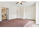 Bedroom with a large window and doors, showing an en-suite bathroom at 2325 Walnut St # 4, Denver, CO 80205