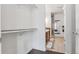 Walk-in closet leading to a bathroom with double sinks and a shower at 2325 Walnut St # 4, Denver, CO 80205