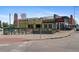 The exterior view of Billy's Gourmet Hot Dogs with a green building in the background at 2325 Walnut St # 4, Denver, CO 80205