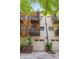 Townhome exterior showcasing private balconies, a spiral staircase, and two-car garages at 2325 Walnut St # 4, Denver, CO 80205