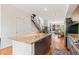 Bright kitchen with large island, stainless appliances, and hardwood floors at 2325 Walnut St # 4, Denver, CO 80205
