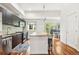 Modern kitchen with granite countertops, stainless steel appliances, and dark cabinets at 2325 Walnut St # 4, Denver, CO 80205