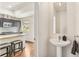 View of a kitchen and adjacent half bathroom featuring modern fixtures at 2325 Walnut St # 4, Denver, CO 80205