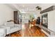 Open living space with views into the kitchen, modern fireplace, and steel staircase at 2325 Walnut St # 4, Denver, CO 80205