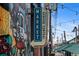 A market sign with lights and a mural beside the entrance to the Denver Central Market at 2325 Walnut St # 4, Denver, CO 80205