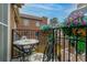 Charming balcony with bistro table, chairs and flower boxes overlooking the neighborhood at 999 N Emerson St # 9, Denver, CO 80218