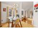 Bright dining area with hardwood floors, large windows, and modern lighting fixtures, creating a stylish dining space at 999 N Emerson St # 9, Denver, CO 80218