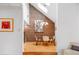 Dining area featuring a brick accent wall, skylights, and modern lighting fixtures to create an inviting atmosphere at 999 N Emerson St # 9, Denver, CO 80218