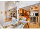 Bright dining area connected to the kitchen and living room featuring hardwood floors and modern décor at 999 N Emerson St # 9, Denver, CO 80218