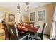 Stylish dining room with unique lighting fixtures, a wooden table, and decorative window design at 999 N Emerson St # 9, Denver, CO 80218