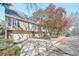 Charming townhome with attached garages and beautiful flowering trees lining the street at 999 N Emerson St # 9, Denver, CO 80218