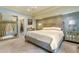Spacious main bedroom featuring a large bed, decorative mirror, and elegant lighting at 999 N Emerson St # 9, Denver, CO 80218