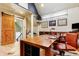 Inviting home office featuring a wooden desk, built-in shelves, and barn door at 999 N Emerson St # 9, Denver, CO 80218