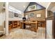 Comfortable home office with hardwood floors, brick accent wall and wooden shelves at 999 N Emerson St # 9, Denver, CO 80218