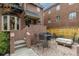 Inviting outdoor patio area with brick pavers, perfect for entertaining or relaxing with a table, chairs, and seating at 999 N Emerson St # 9, Denver, CO 80218