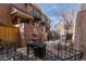 Private patio with a fountain, dining table, and seating, creating an outdoor haven at 999 N Emerson St # 9, Denver, CO 80218